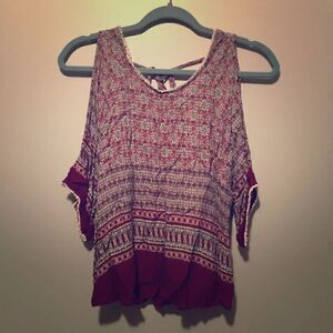 Open shoulder, low back, paisley top.